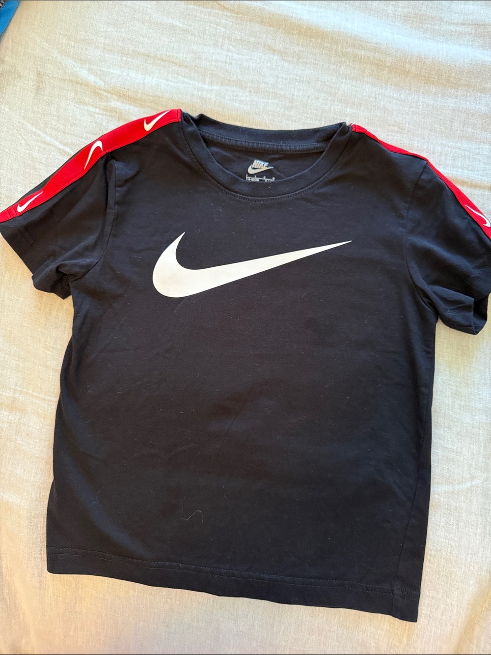 Nike Black Tee with White Swoosh and Red Shoulder Stripes
